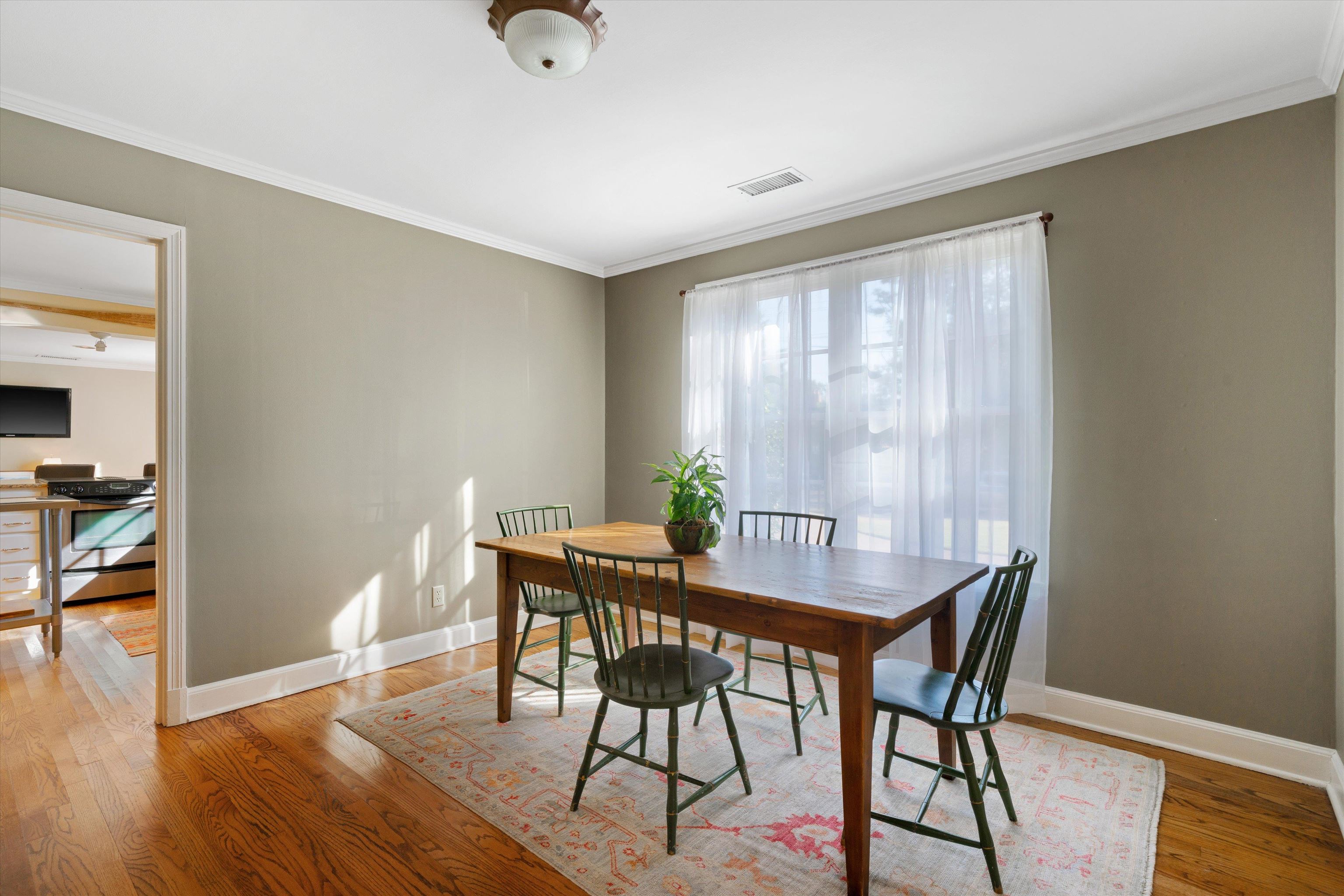 567 South Yates Road Memphis, TN 38120 - Photo 5 of 20 a view of a dining room with furniture window and wooden floor