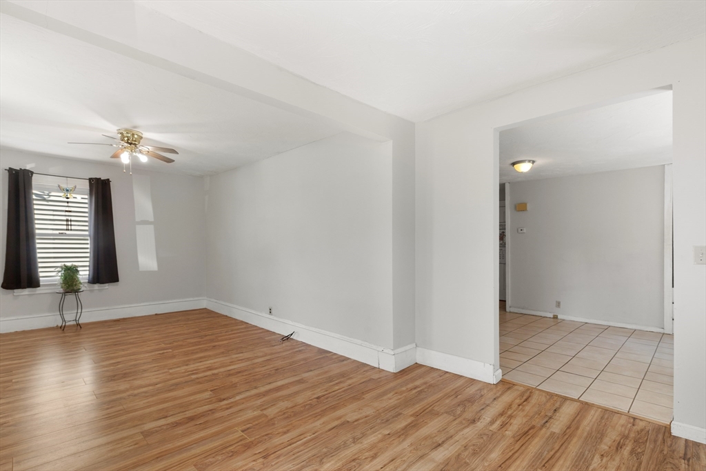 22 Montgomery Street Fall River, MA 02720 - Photo 9 of 22 a view of an empty room with wooden floor and a window