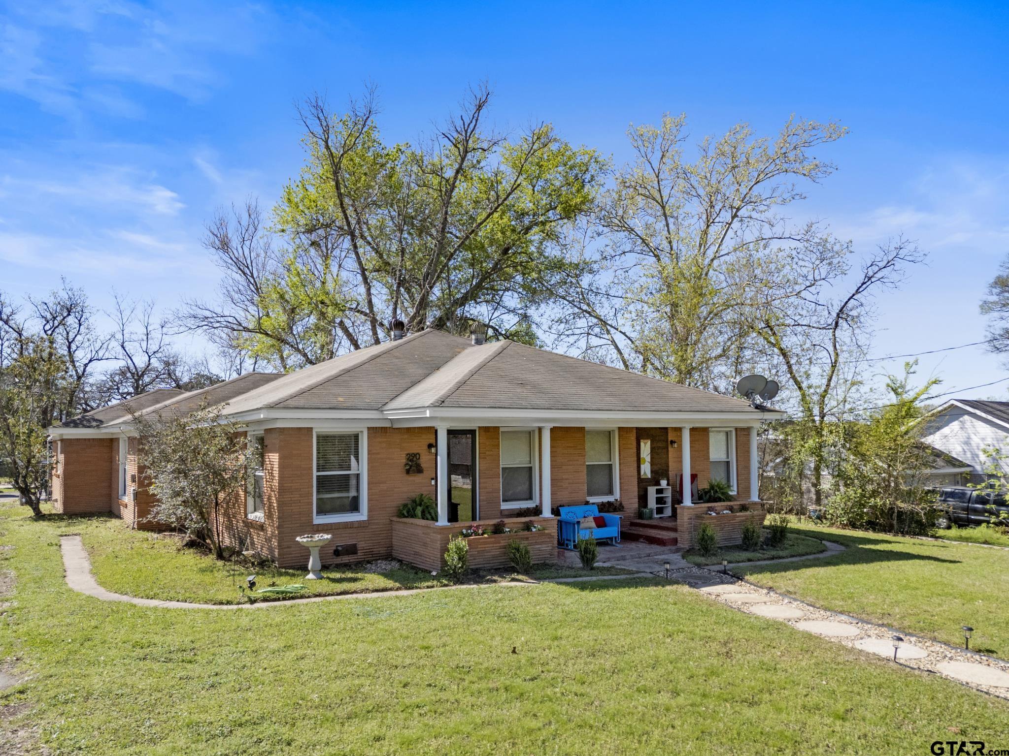 290 Lynch Street Hawkins, TX 75765 - Photo 1 of 36 a front view of a house with swimming pool and garden