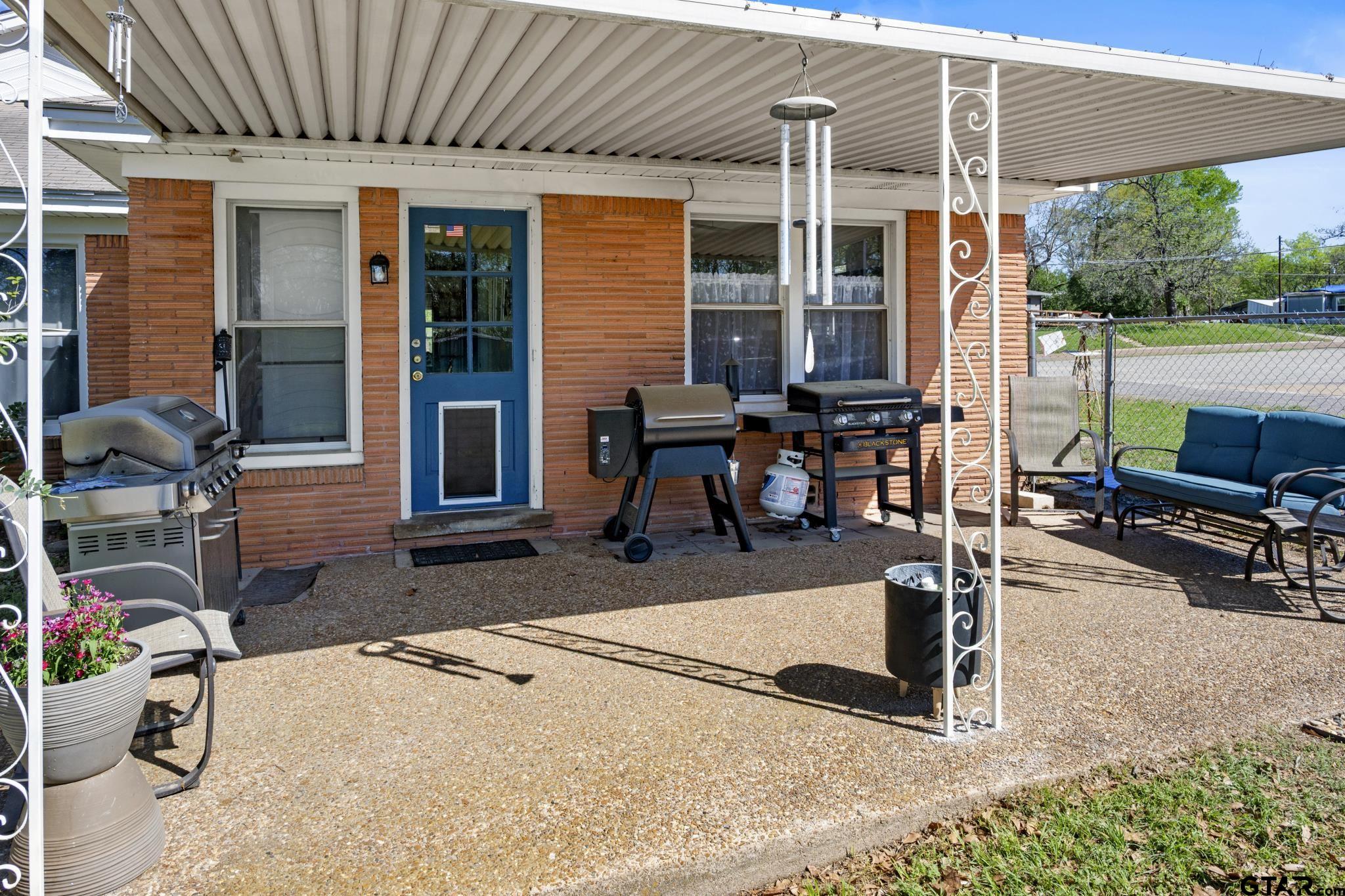 290 Lynch Street Hawkins, TX 75765 - Photo 23 of 36 a building outdoor space with patio furniture and potted plants