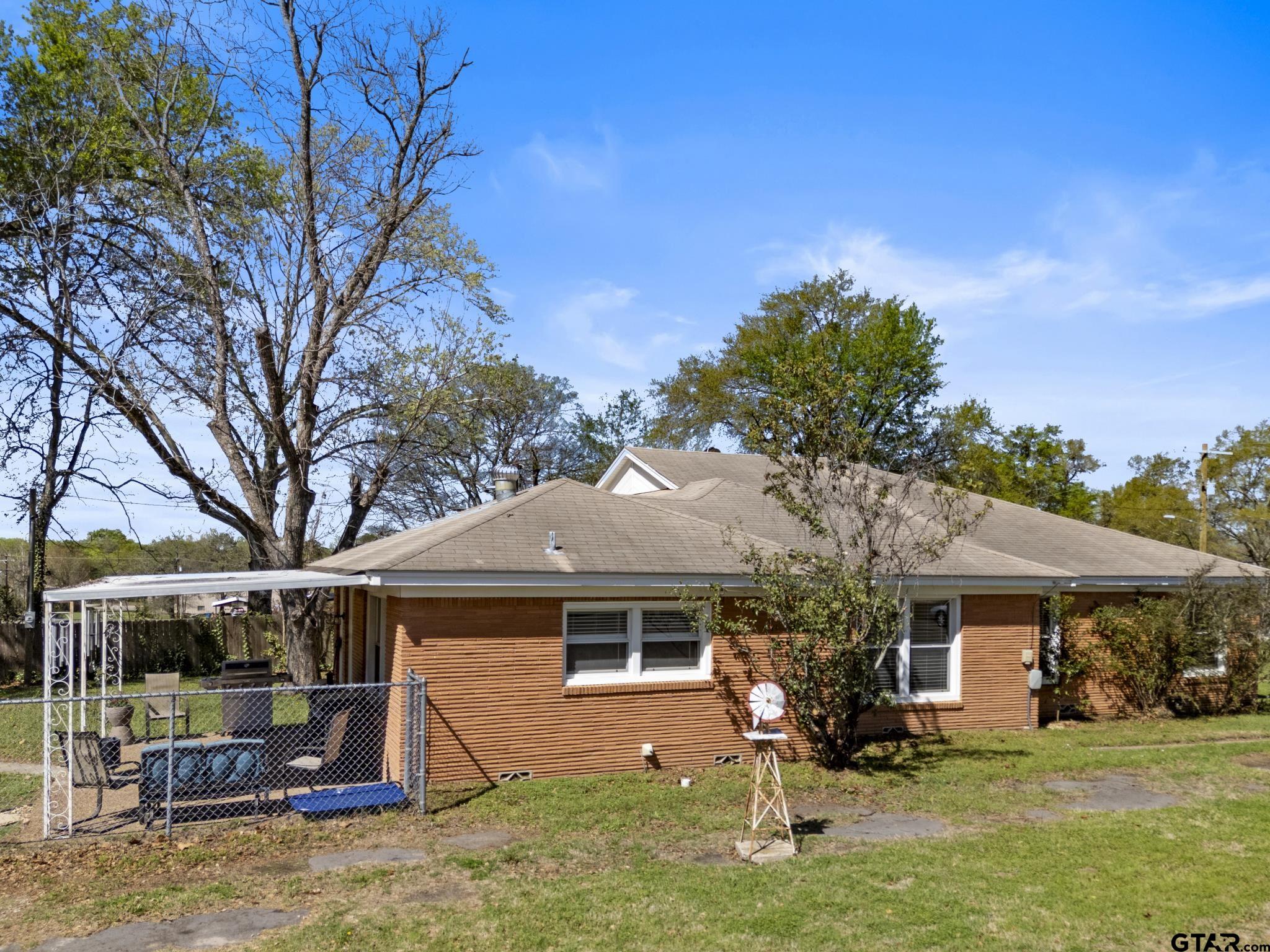 290 Lynch Street Hawkins, TX 75765 - Photo 30 of 36 a front view of a house with garden