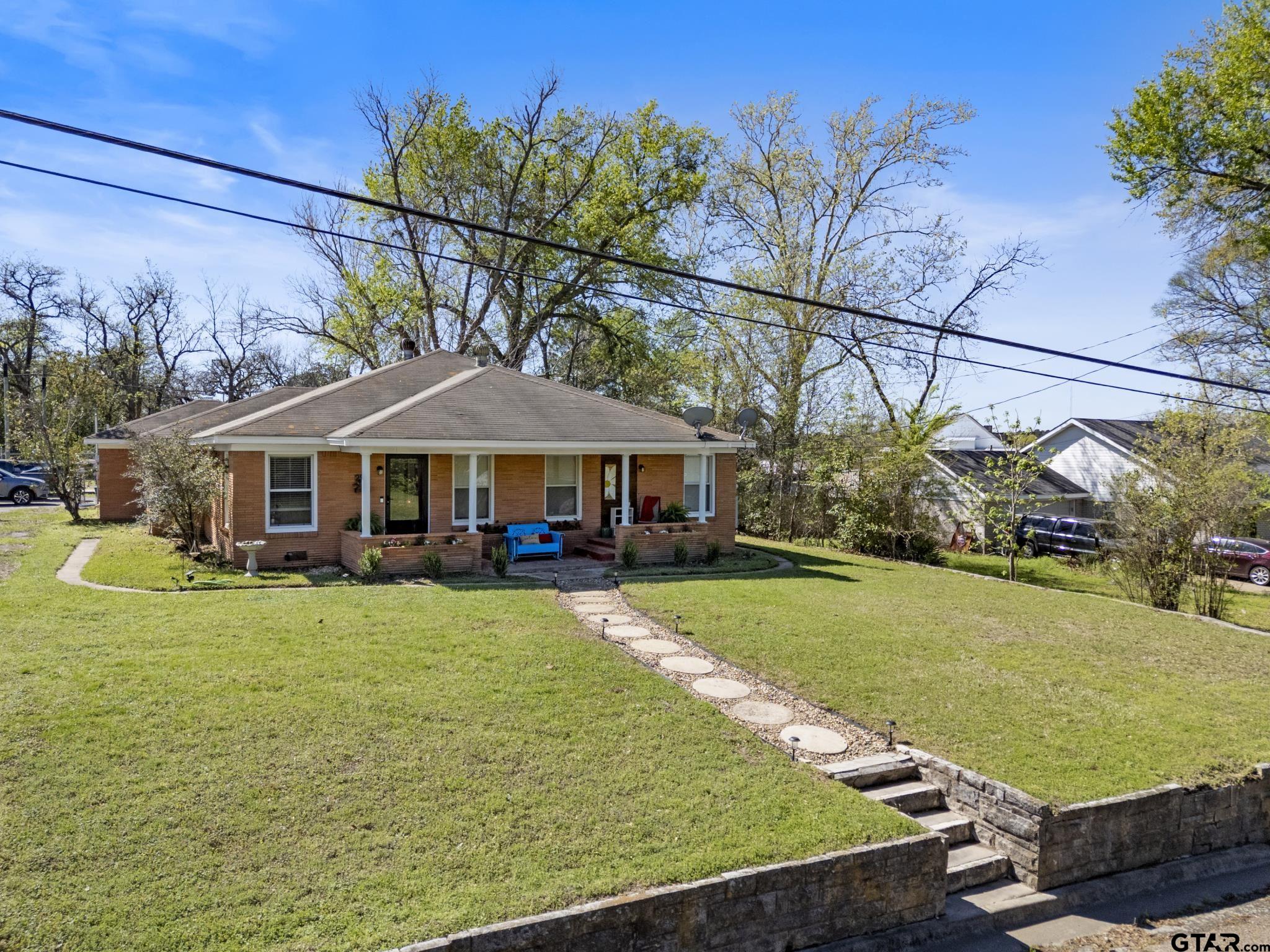 290 Lynch Street Hawkins, TX 75765 - Photo 31 of 36 a front view of a house with garden