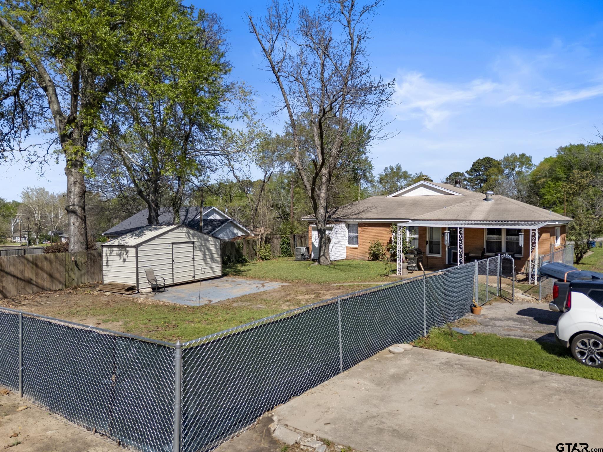 290 Lynch Street Hawkins, TX 75765 - Photo 33 of 36 a view of a house with backyard and sitting area