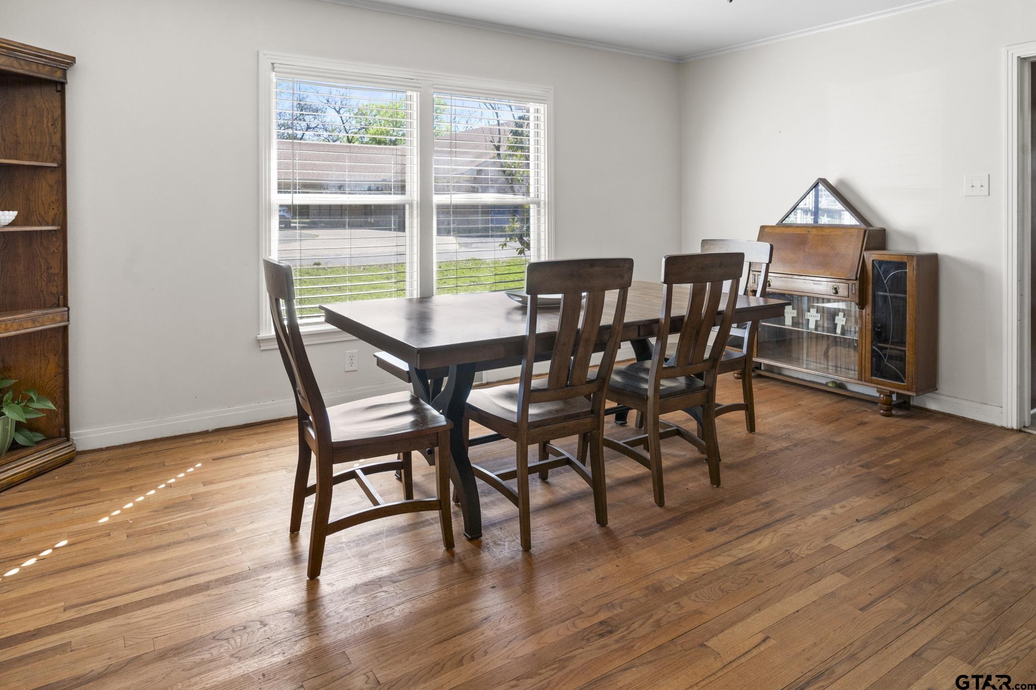 290 Lynch Street Hawkins, TX 75765 - Photo 8 of 36 a view of a dining room with furniture and wooden floor