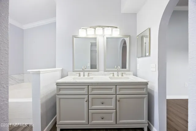 a bathroom with a sink and a mirror