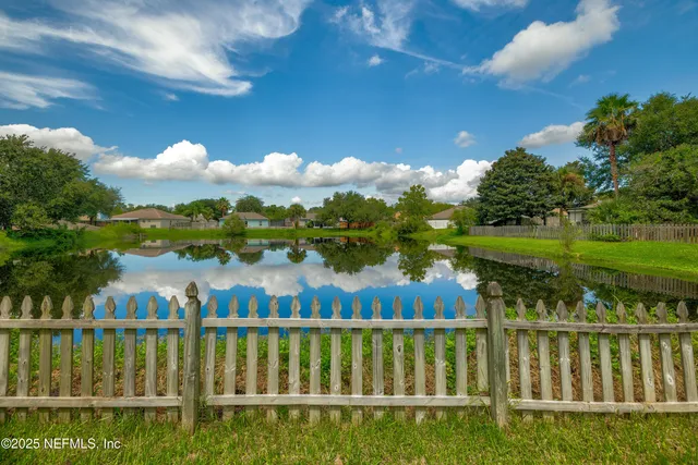 a view of a lake with a garden
