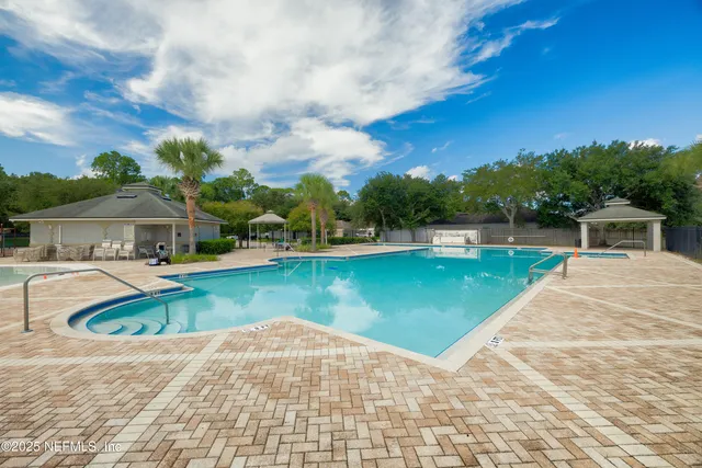 a view of a swimming pool with a yard