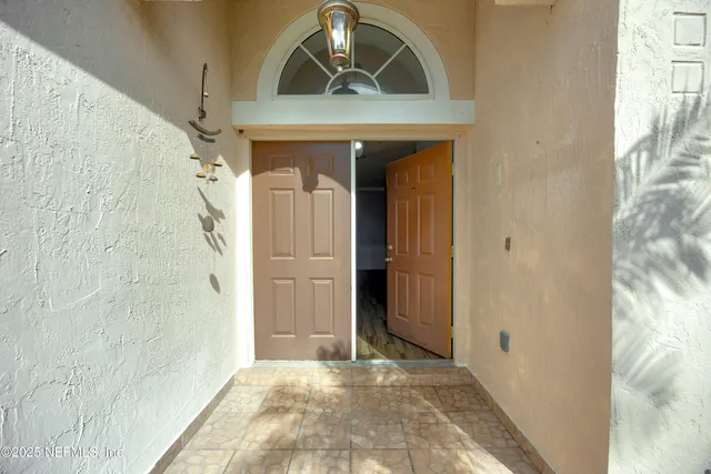 a view of a hallway with entryway