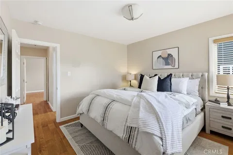 a bedroom with a bed and a sink