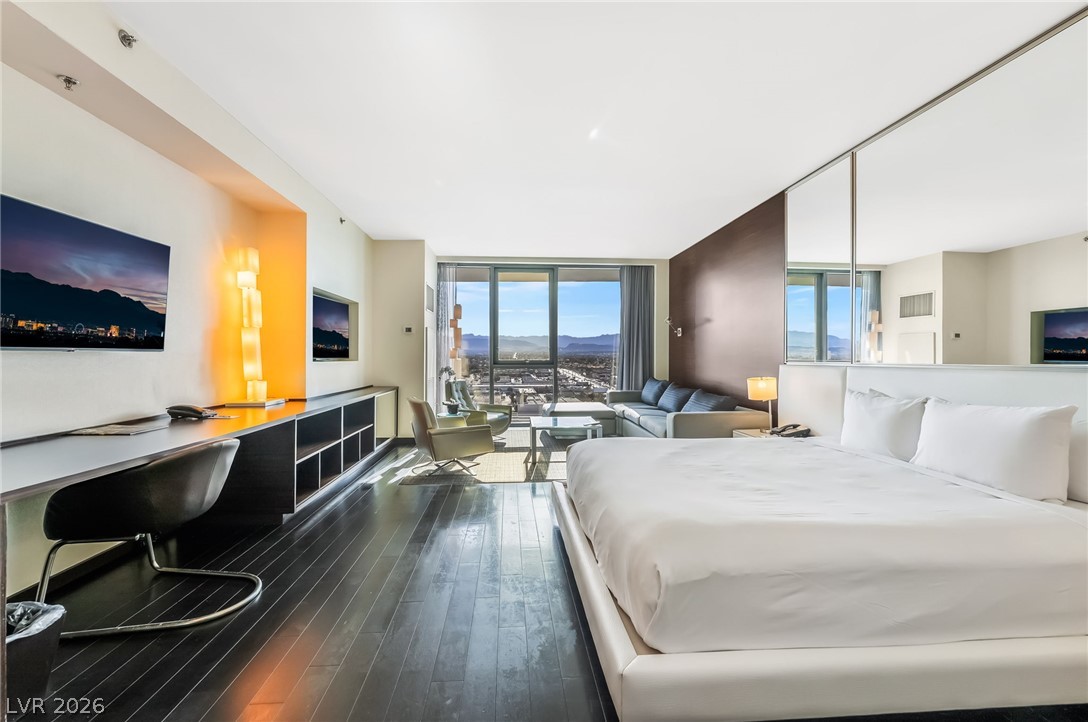 4381 West Flamingo Road, Unit 18305 Las Vegas, NV 89103 - Photo 12 of 19 Experience elevated living in this urban suite, offering commanding city and mountain panoramas.