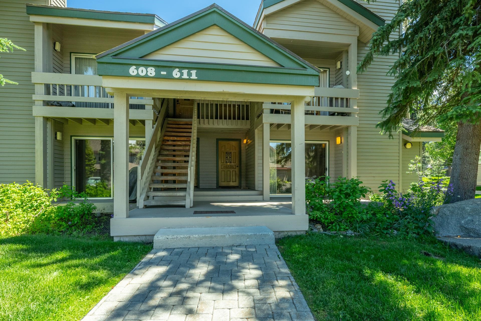 609 Golden Creek Road, Unit 609 Mammoth Lakes, CA 93546 - Photo 33 of 42 Multi-level building exterior featuring light green siding and dark green trim accents