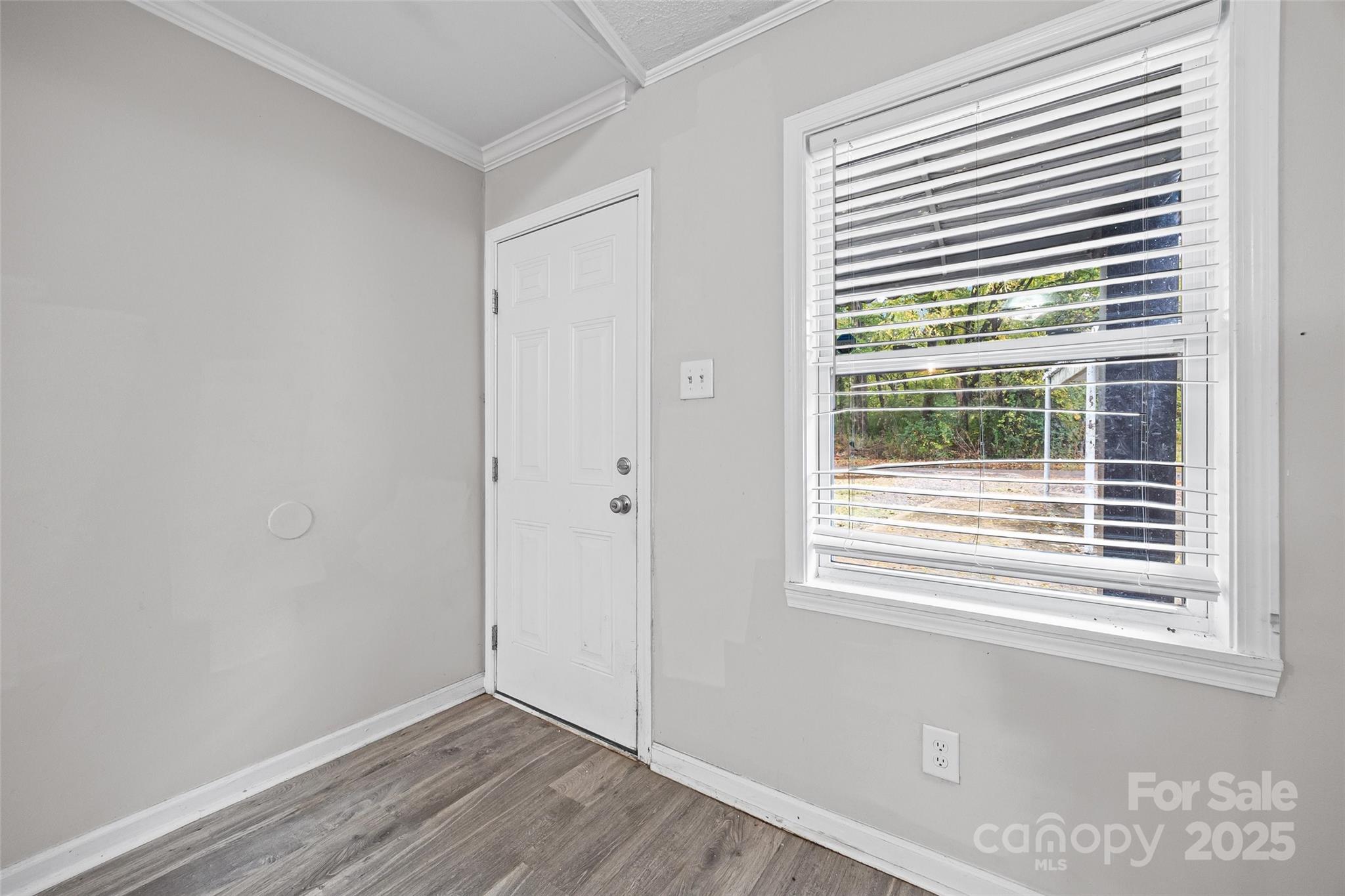 616 Simpson Street Rock Hill, SC 29730 - Photo 12 of 21 a view of an empty room with wooden floor and a window