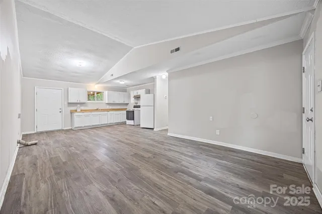 a view of a kitchen with a sink and a stove top oven