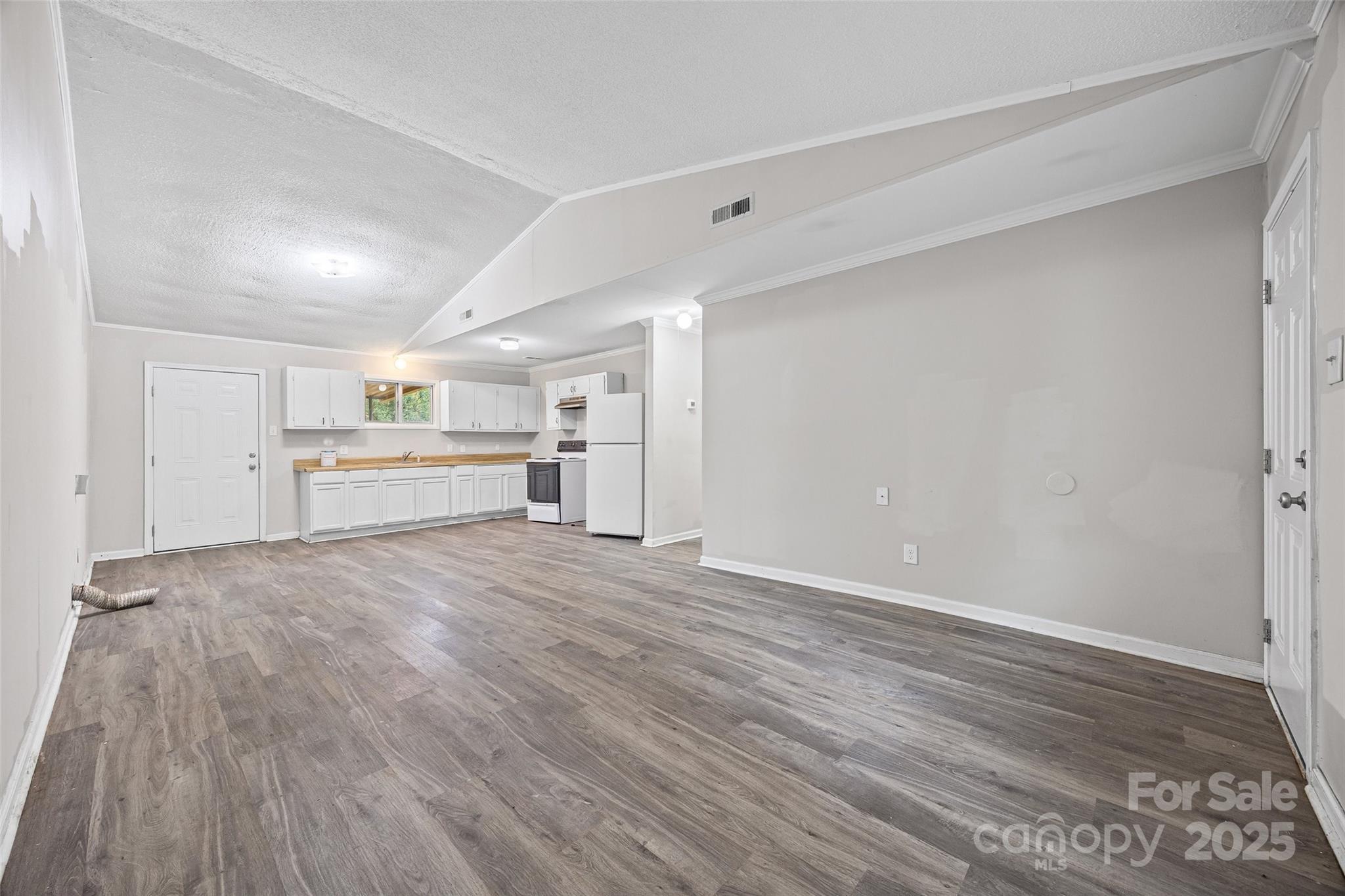 616 Simpson Street Rock Hill, SC 29730 - Photo 3 of 21 a view of a kitchen with a sink and a stove top oven
