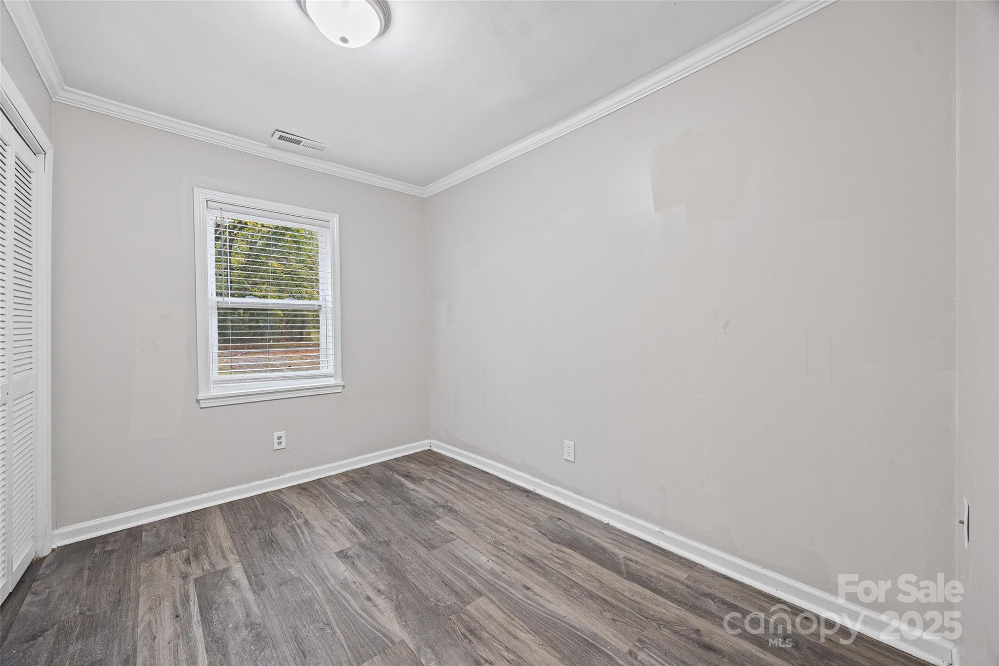 616 Simpson Street Rock Hill, SC 29730 - Photo 10 of 21 wooden floor in an empty room with a window