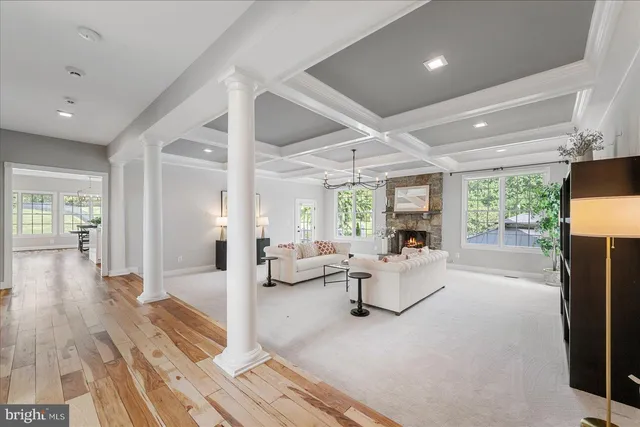 a dining room with furniture window and wooden floor
