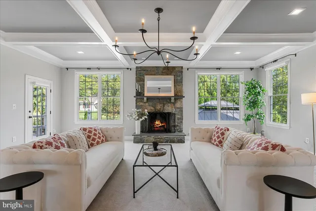 a large kitchen with kitchen island a large counter space a sink appliances and cabinets