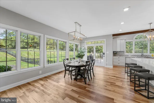 a bedroom with a large bed and a large window