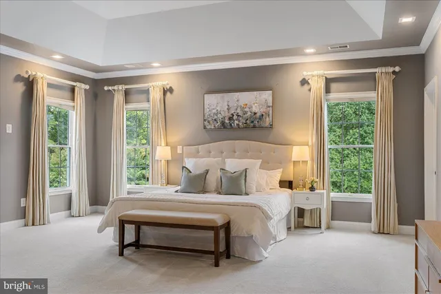 a view of a room with wooden floor and windows