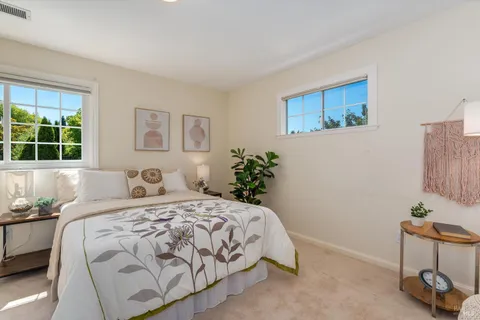 a view of a house with a yard and garden