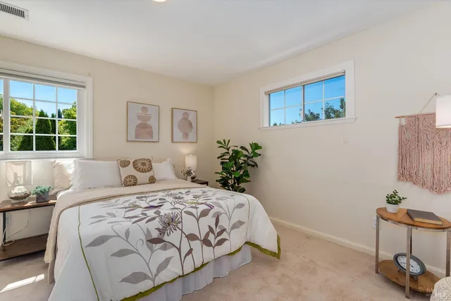 a view of a house with a yard and garden