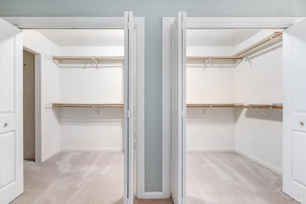 a wooden fence with trees in the background