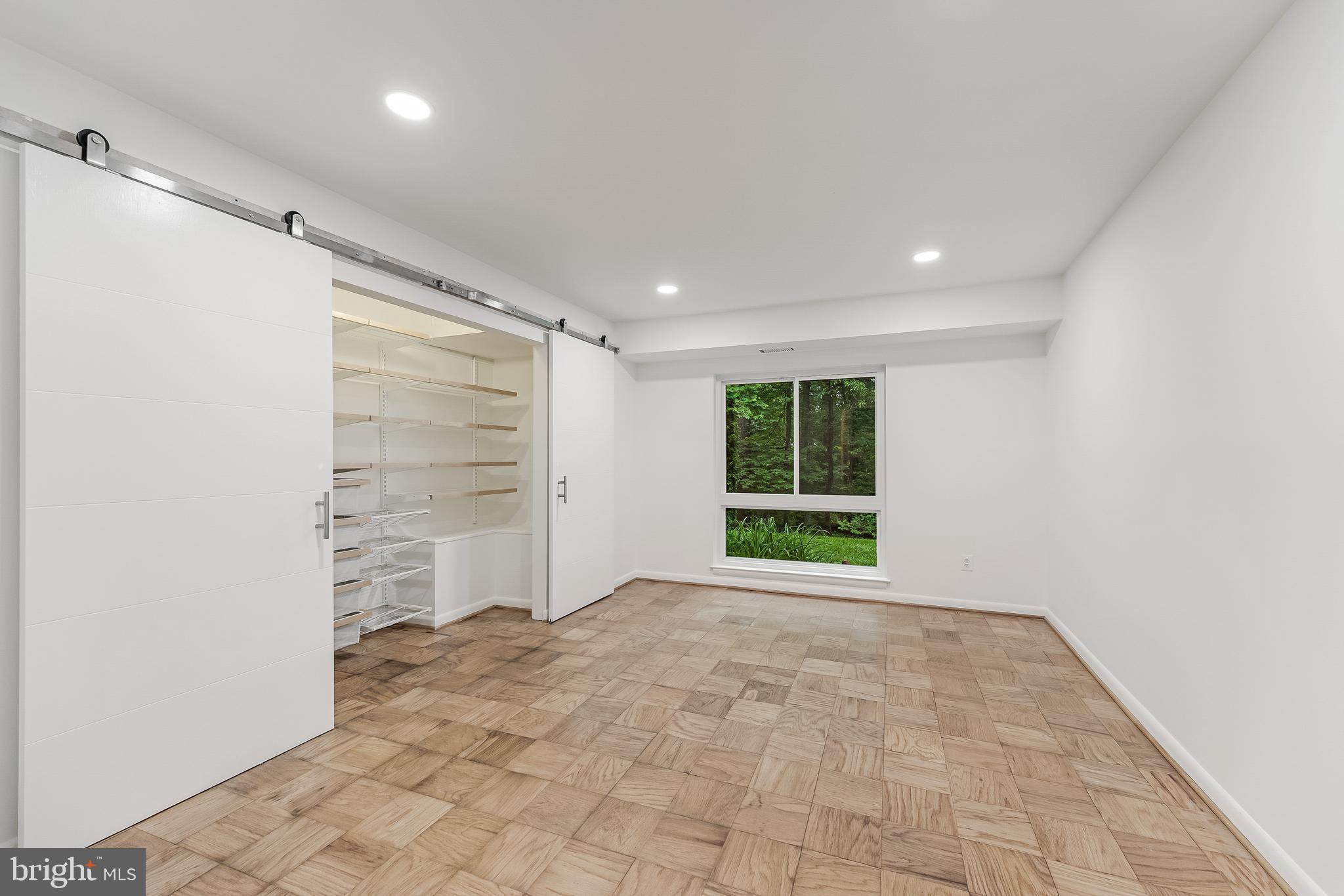11619 Vantage Hill Road, Unit 2A Reston, VA 20190 - Photo 16 of 25 Primary bedroom w/ Container Store closet shelving