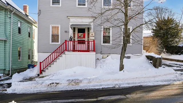 a view of house with wooden deck and living room