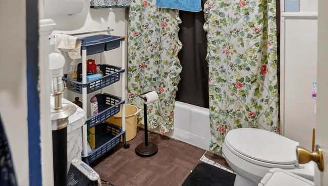 a living room with furniture and a lamp