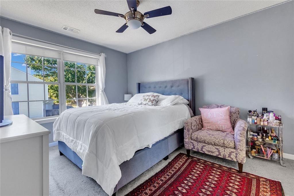 13300 Morris Road, Unit 4 Alpharetta, GA 30004 - Photo 14 of 36 a bedroom with a bed and window