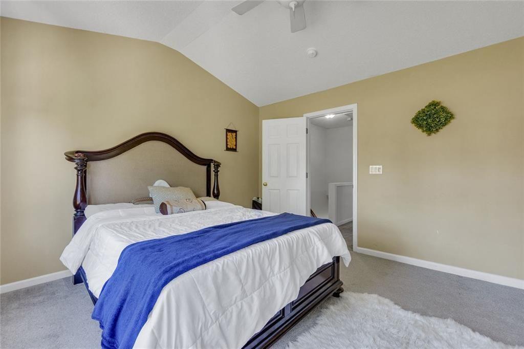 13300 Morris Road, Unit 4 Alpharetta, GA 30004 - Photo 18 of 36 a bedroom with a bed and a mirror