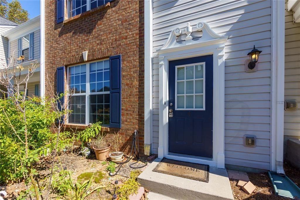 13300 Morris Road, Unit 4 Alpharetta, GA 30004 - Photo 2 of 36 a front view of a house with a yard