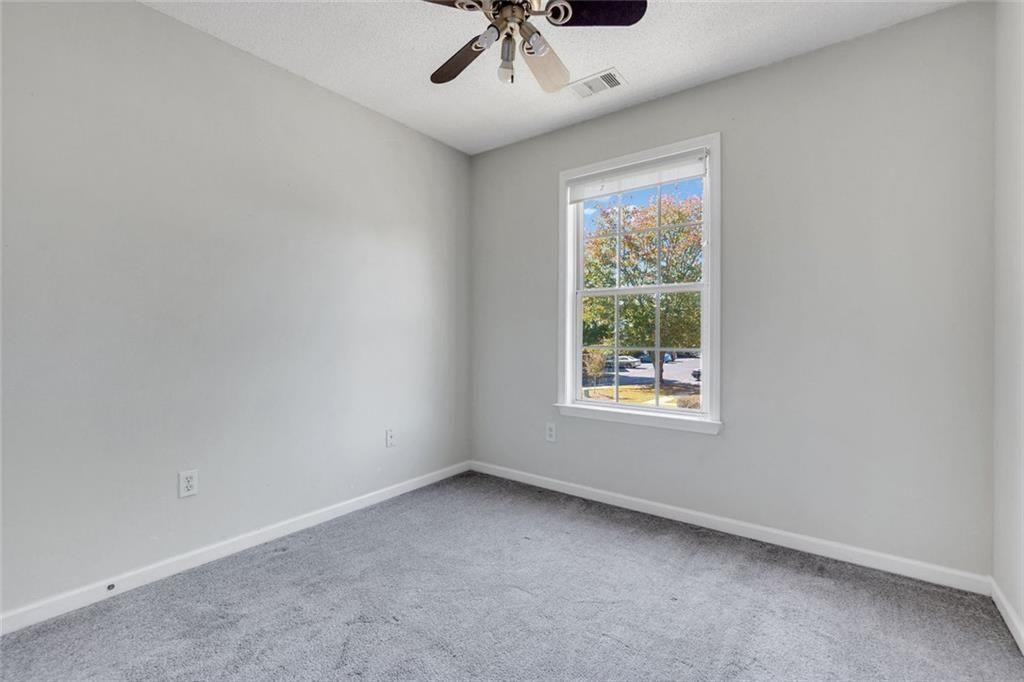 13300 Morris Road, Unit 4 Alpharetta, GA 30004 - Photo 21 of 36 a view of an empty room with a window