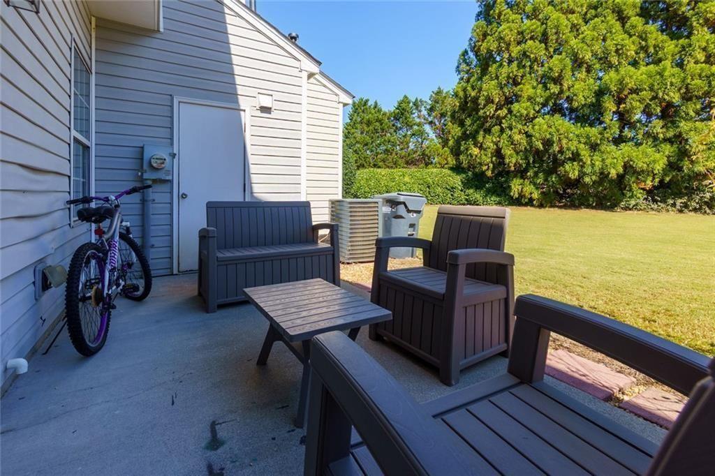 13300 Morris Road, Unit 4 Alpharetta, GA 30004 - Photo 22 of 36 a view of a roof deck with wooden floor and fence