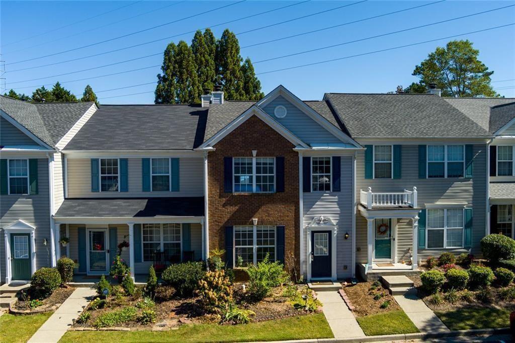 13300 Morris Road, Unit 4 Alpharetta, GA 30004 - Photo 26 of 36 a front view of a house with garden