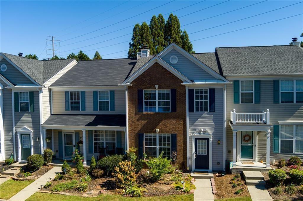 13300 Morris Road, Unit 4 Alpharetta, GA 30004 - Photo 27 of 36 a front view of a house with garden