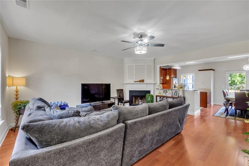13300 Morris Road, Unit 4 Alpharetta, GA 30004 - Photo 3 of 36 a living room with furniture and a flat screen tv
