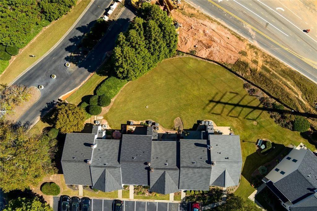 13300 Morris Road, Unit 4 Alpharetta, GA 30004 - Photo 32 of 36 an aerial view of residential houses with outdoor space