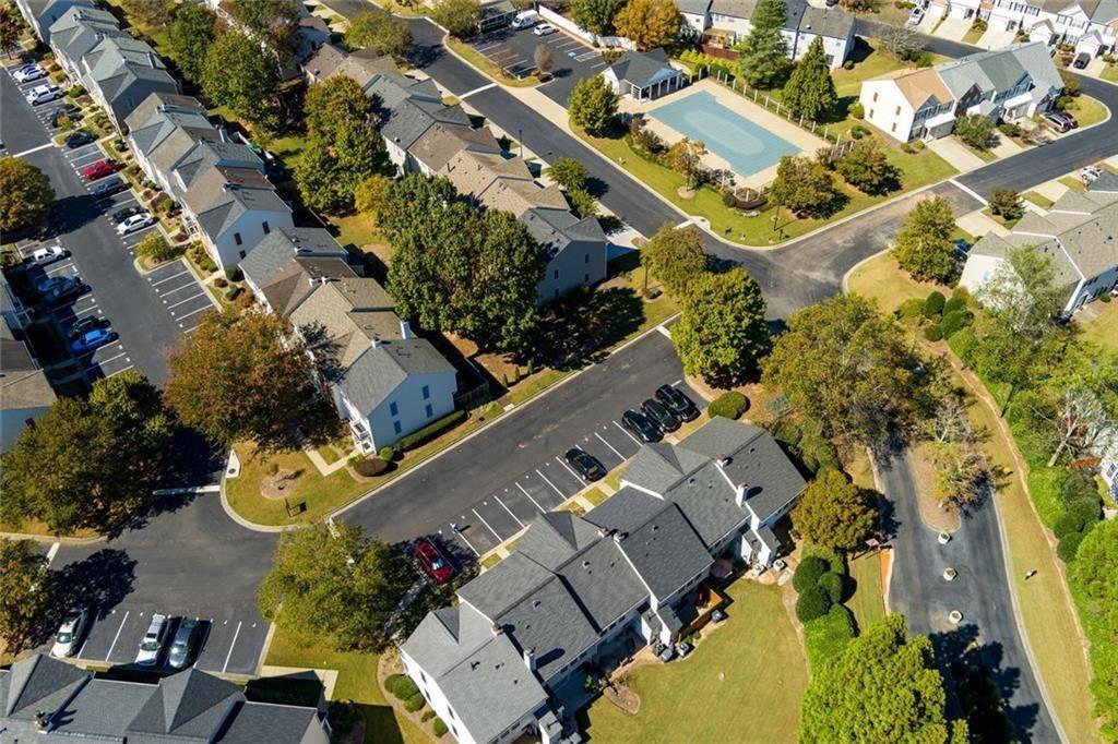 13300 Morris Road, Unit 4 Alpharetta, GA 30004 - Photo 34 of 36 an aerial view of multiple houses with yard