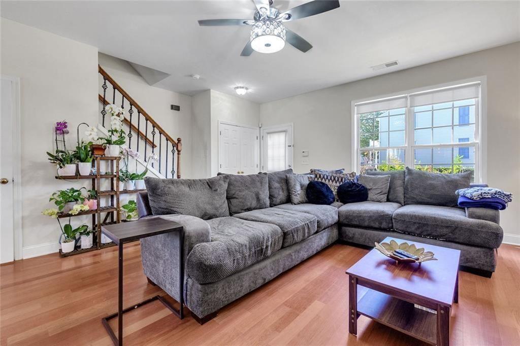 13300 Morris Road, Unit 4 Alpharetta, GA 30004 - Photo 7 of 36 a living room with furniture and wooden floor