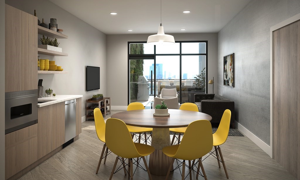 30 Penniman Road, Unit 305 Boston, MA 02134 - Photo 1 of 9 a view of a dining room with furniture window and outside view