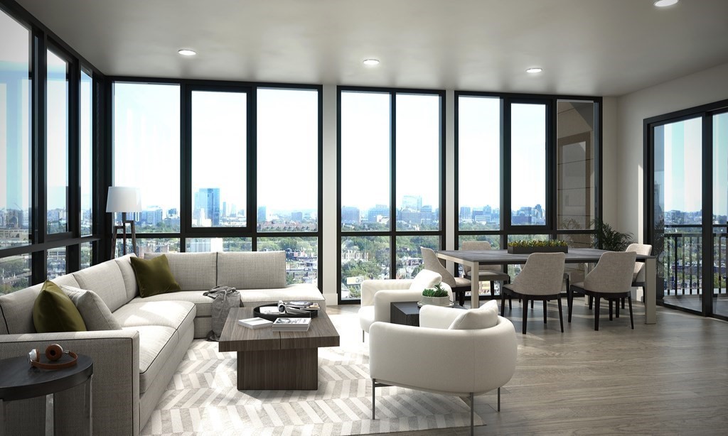 30 Penniman Road, Unit 305 Boston, MA 02134 - Photo 4 of 9 a living room with furniture and floor to ceiling windows