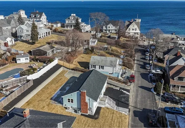 an aerial view of a house with a ocean view