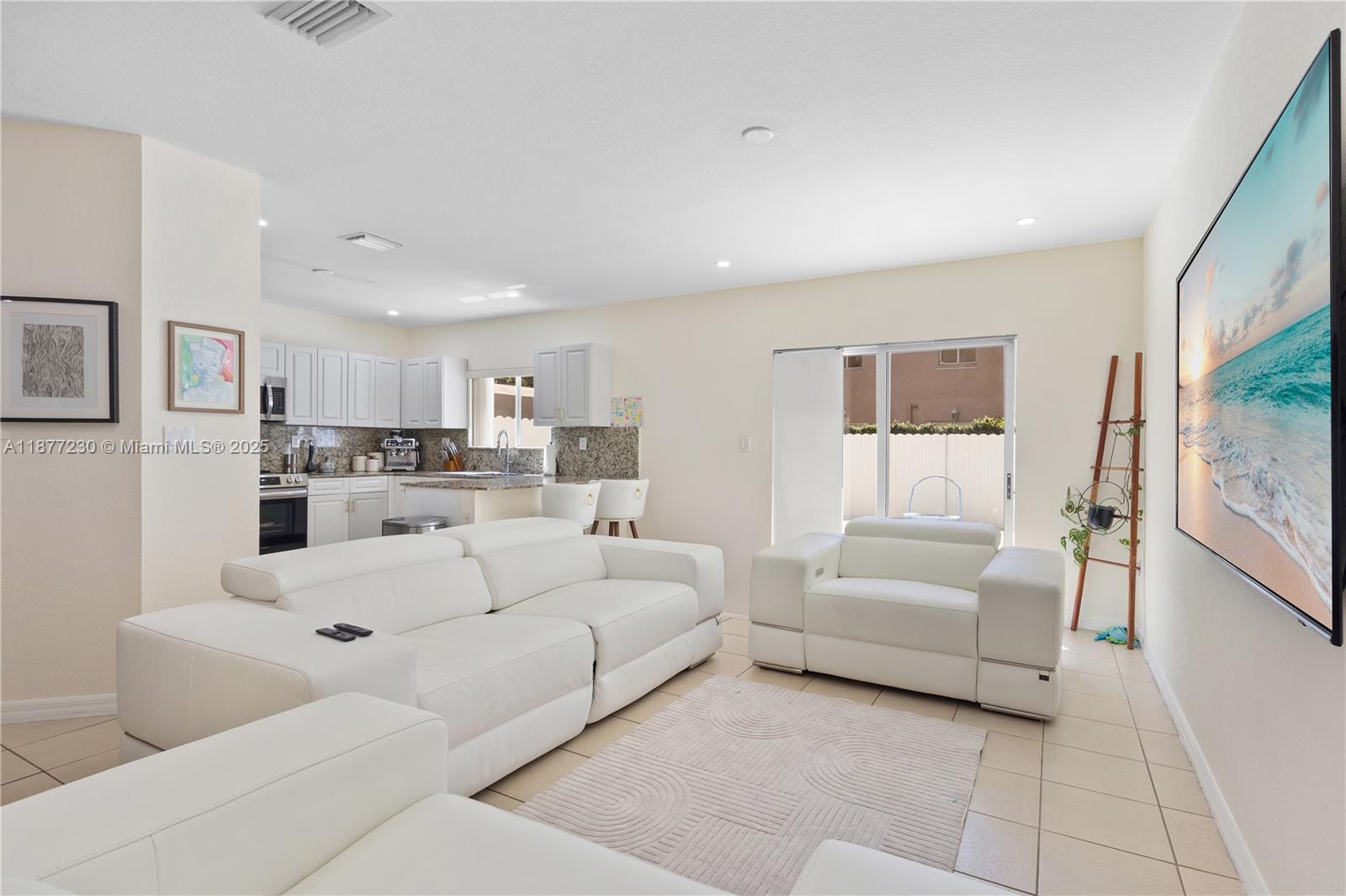16256 Southwest 57th Lane Miami, FL 33193 - Photo 11 of 32 a living room with furniture and a large window