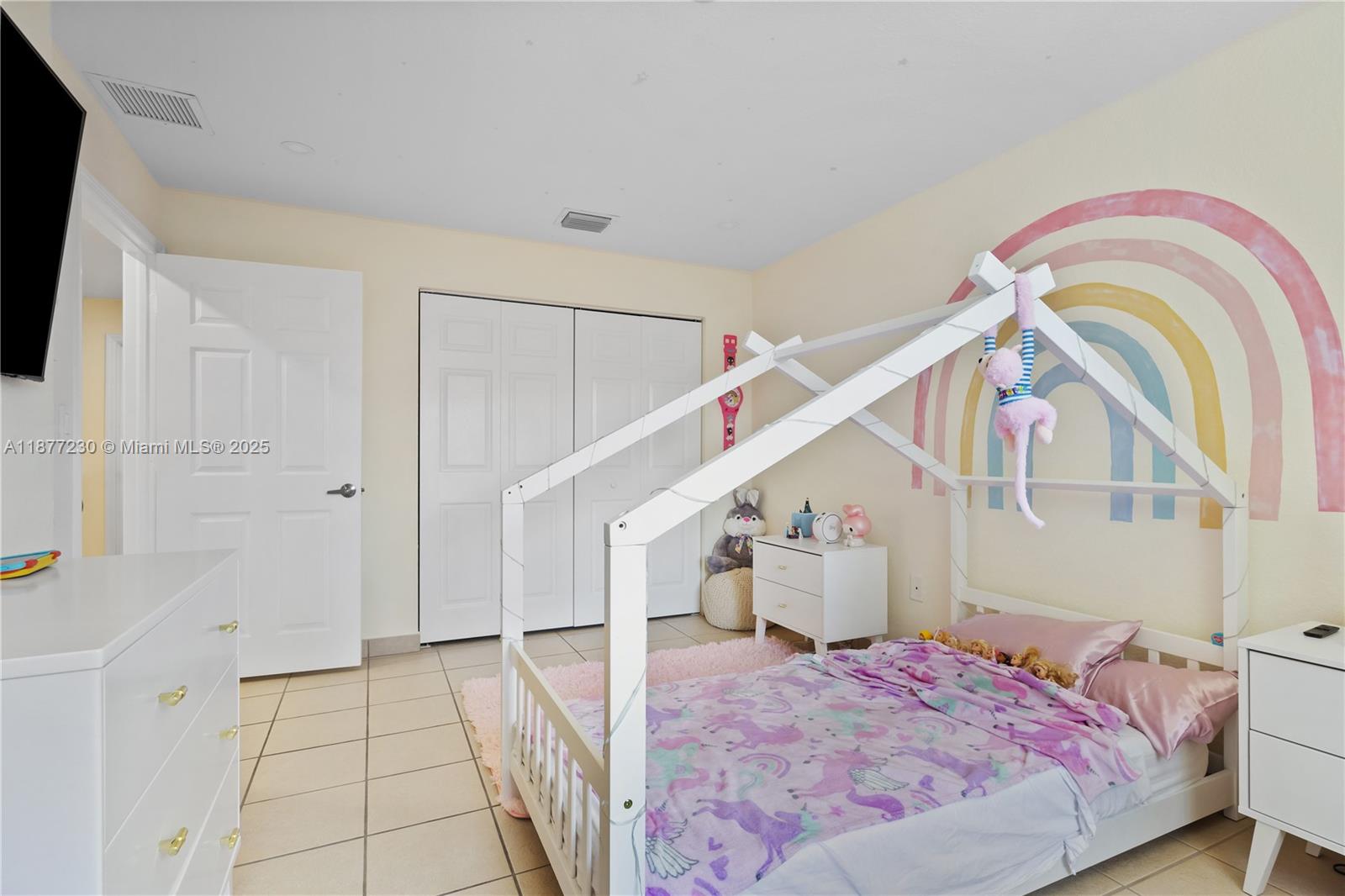 16256 Southwest 57th Lane Miami, FL 33193 - Photo 25 of 32 a view of a bedroom with a bed and white walls