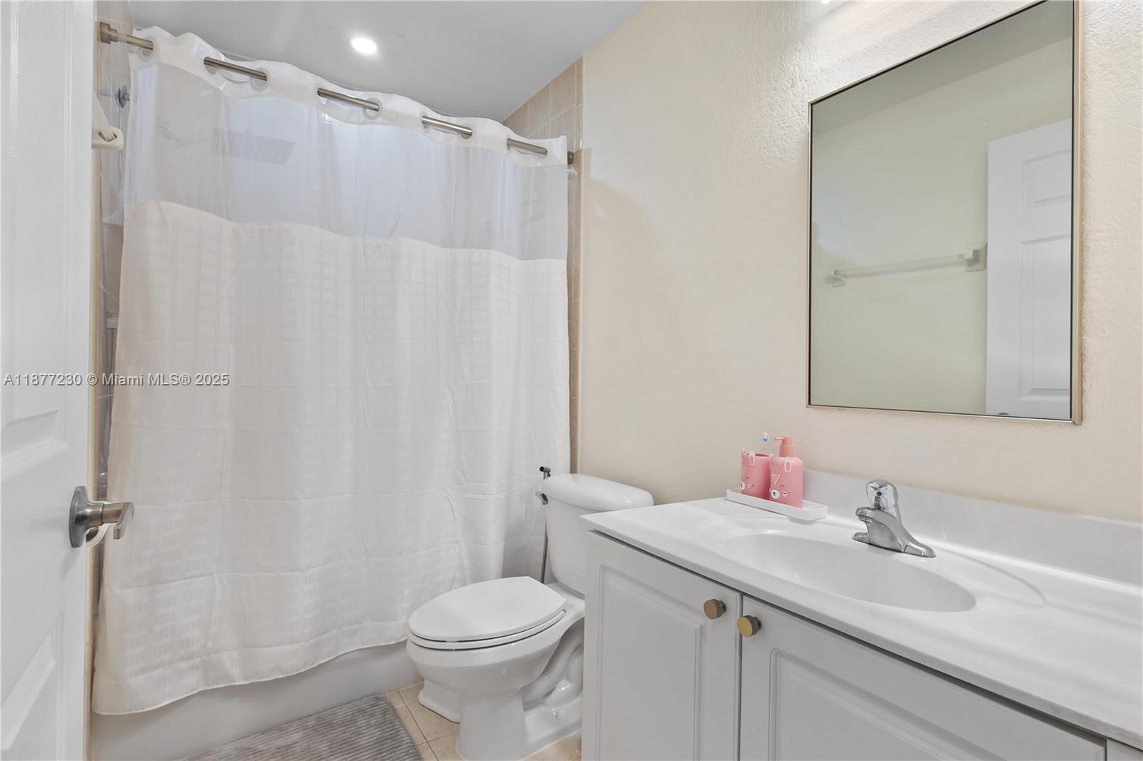 16256 Southwest 57th Lane Miami, FL 33193 - Photo 26 of 32 a bathroom with a sink a toilet and shower