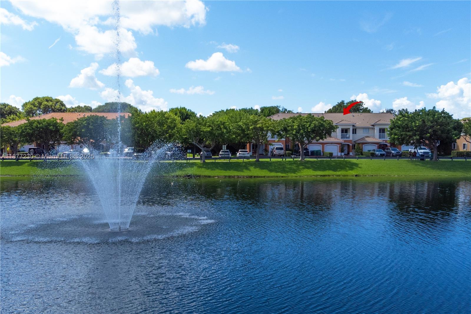 16256 Southwest 57th Lane Miami, FL 33193 - Photo 32 of 32 a view of a lake with a house in the background