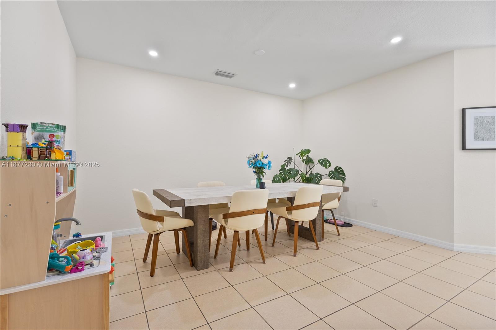 16256 Southwest 57th Lane Miami, FL 33193 - Photo 8 of 32 a view of a dining room with furniture