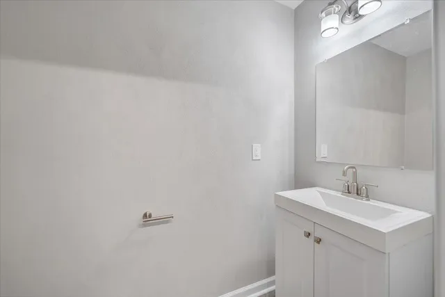 a view of backyard with barbeque grill and a large tree