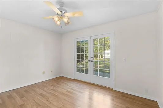 a view of an empty room with a window